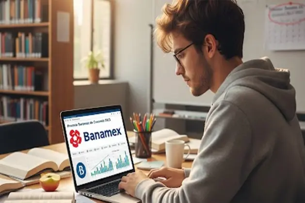 Joven estudiante o investigador revisando gráficas económicas en una laptop, representando la participación en el Premio Banamex de Economía 2025